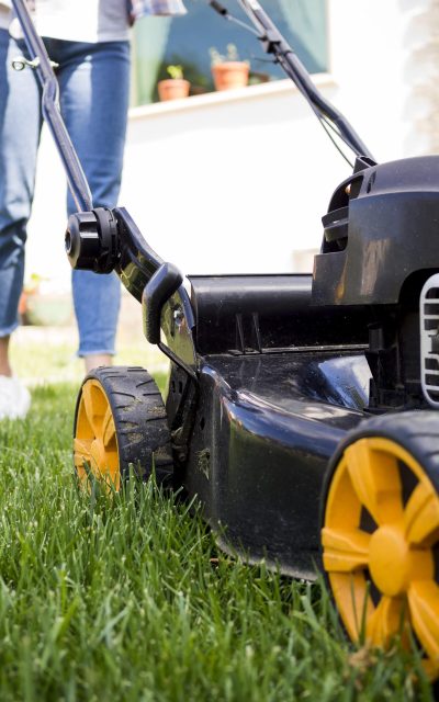 woman-mowing-yard-close-up